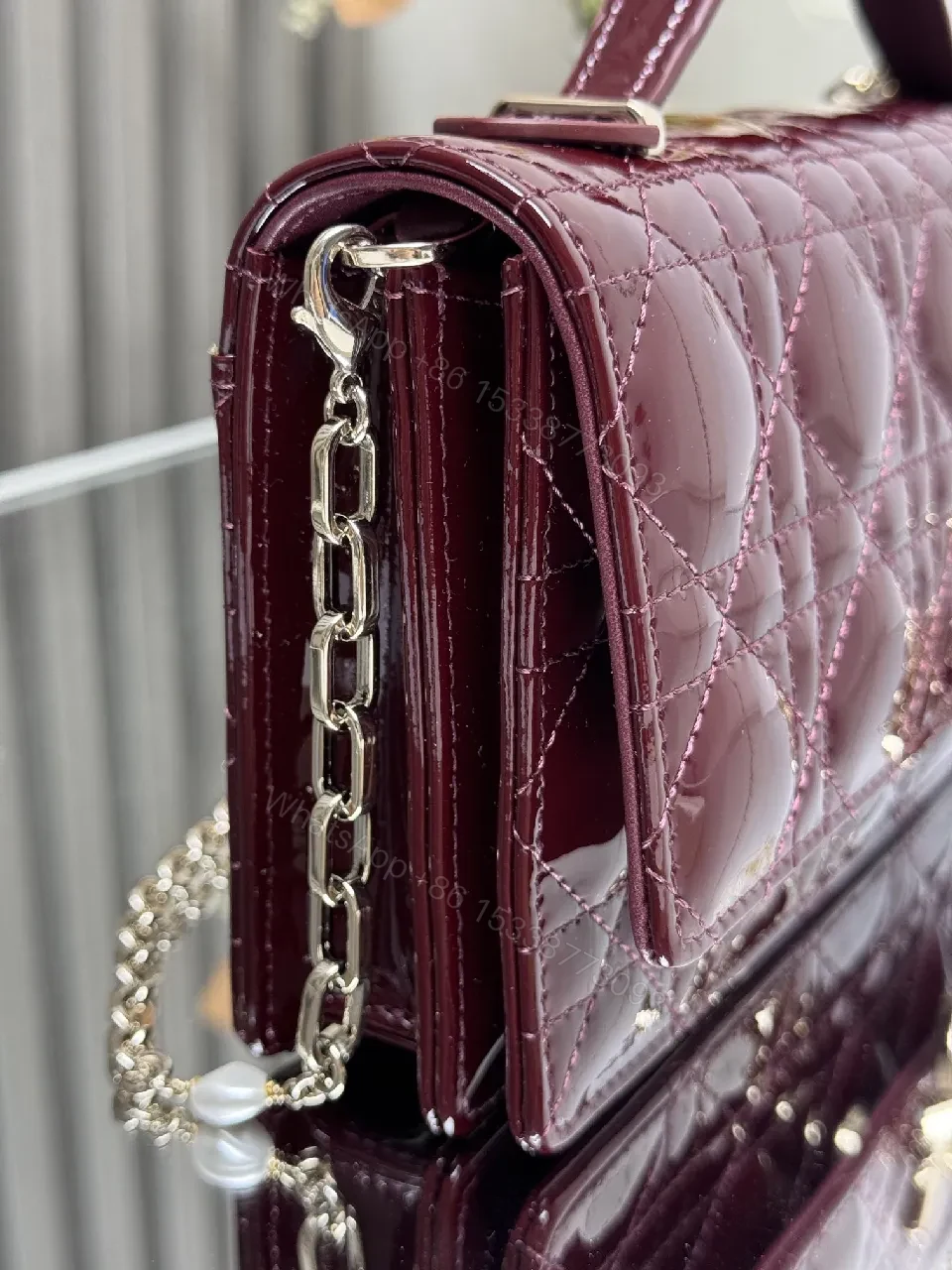View 5 of Burgundy Patent Leather Clutch: Geometric Quilted Luxury