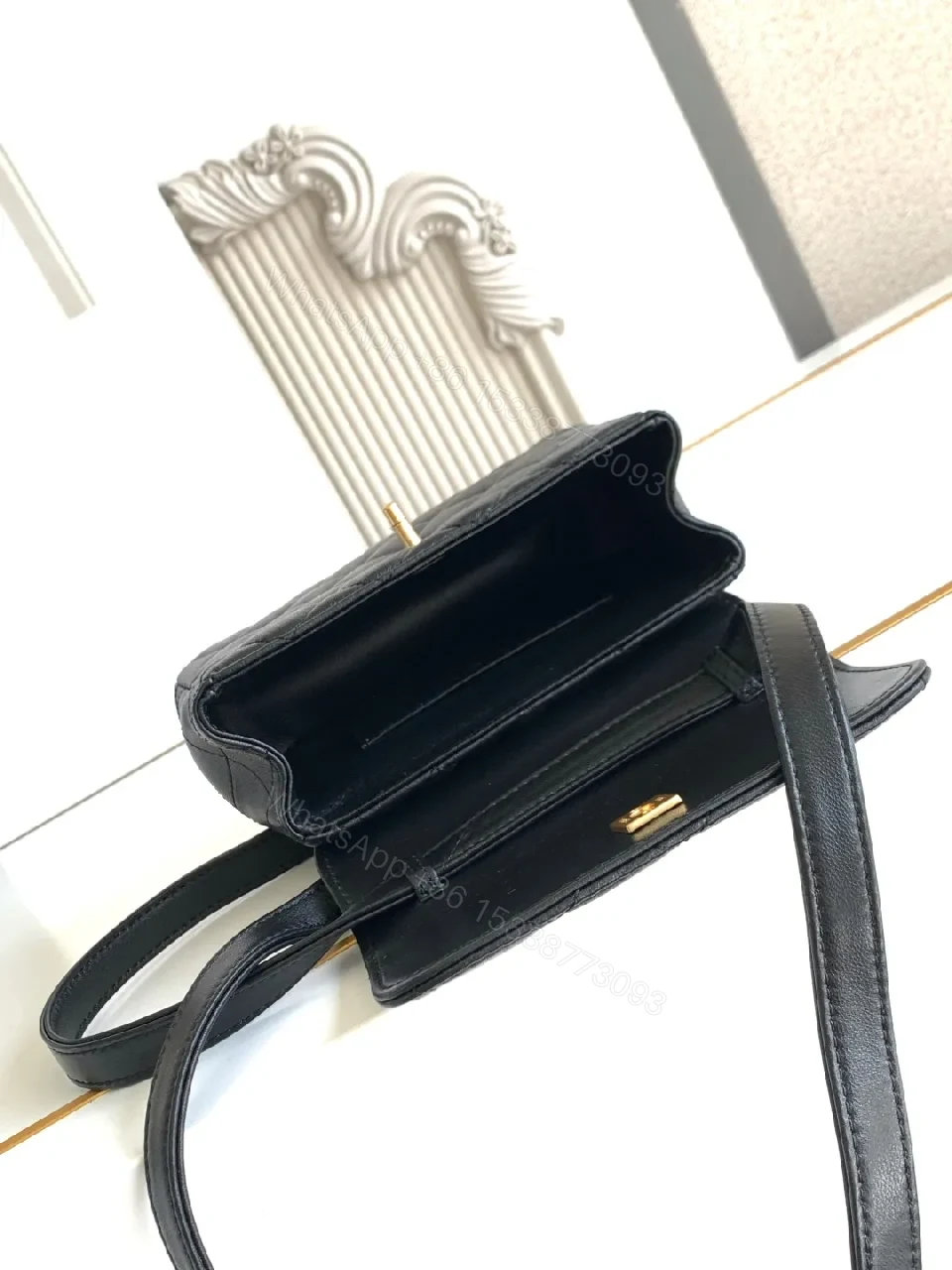 View 6 of Compact Black Quilted Bag with Gold Hardware