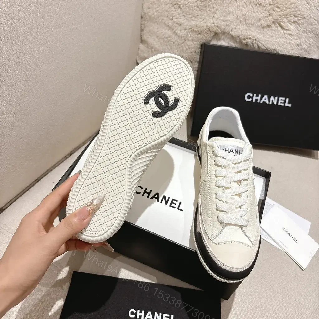 View 10 of Cream Leather-Texture Sneaker with Signature Emblem, Modern Couture Style