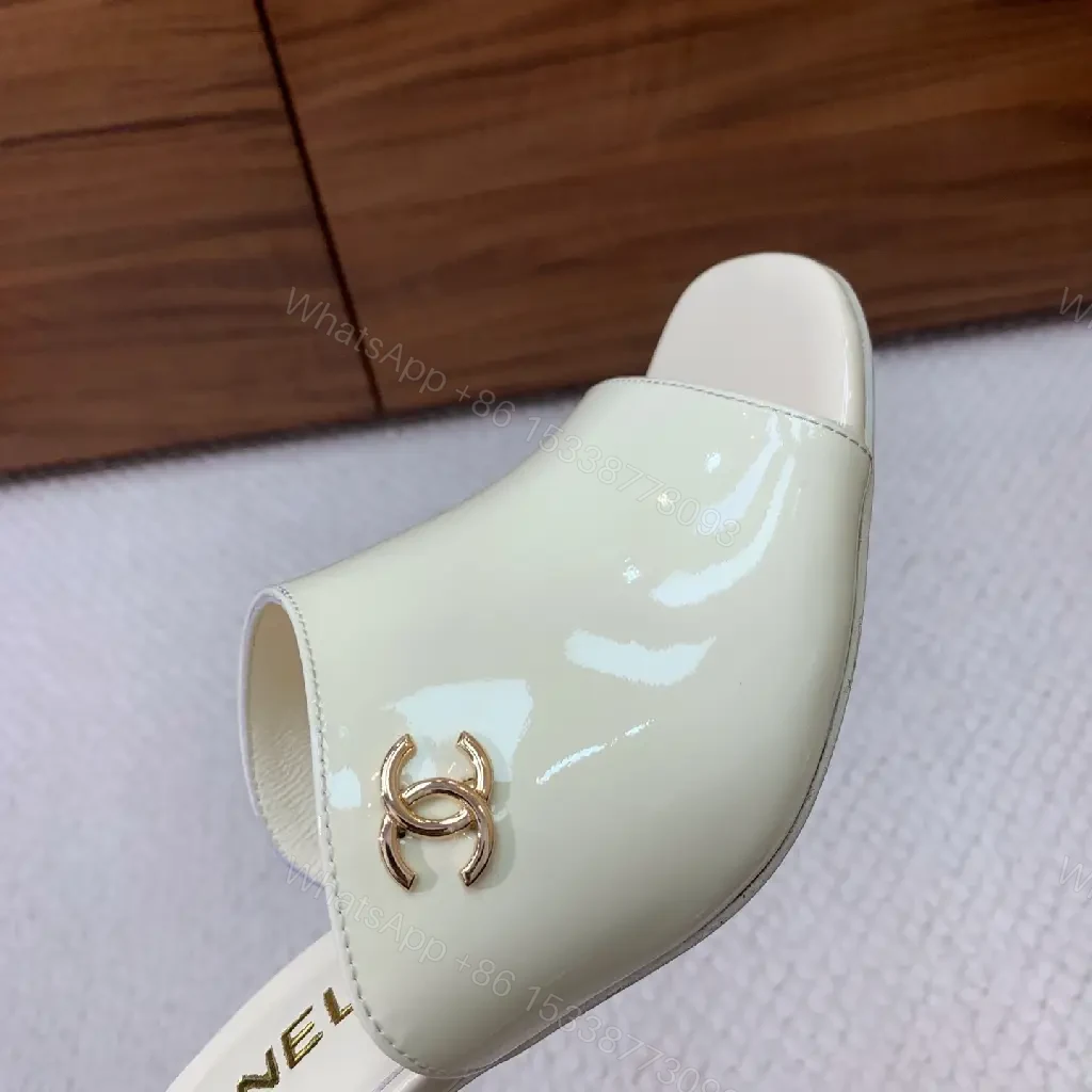 View 3 of Cream Leather Slide Sandals, Pearl White, Chanel Logo, Midsize Heel Mules