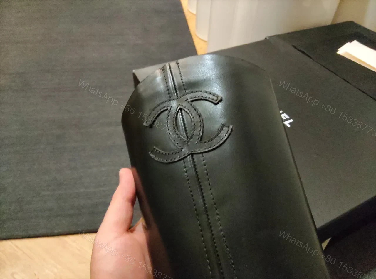 View 6 of Black Leather Knee-High Boots with Logo Embossed Signature