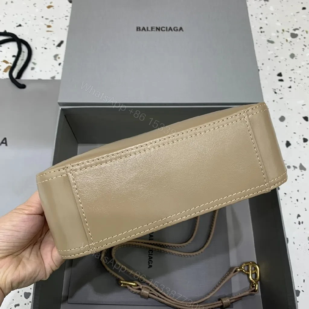 View 3 of Compact Taupe Leather Handbag with Gold Hardware, Crossbody Ready