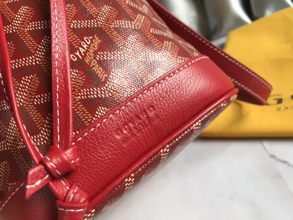 View 8 of Bold Goyardine Bucket Bag in Red Leather Trim