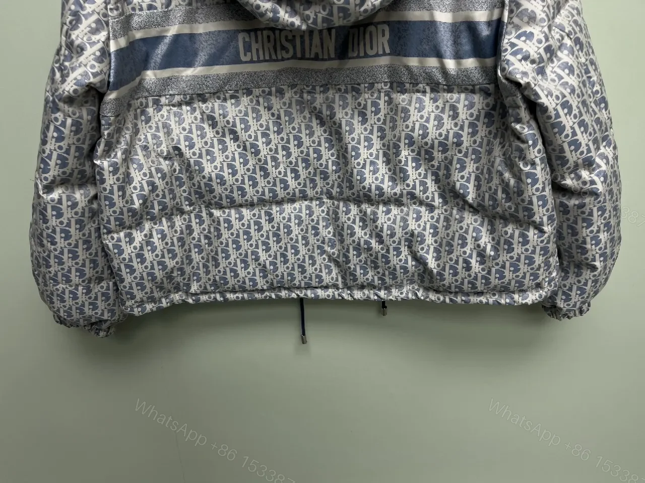 View 4 of Monochrome Puffer Jacket: Monogram Texture, Modern Warmth, Street-Ready Outerwear