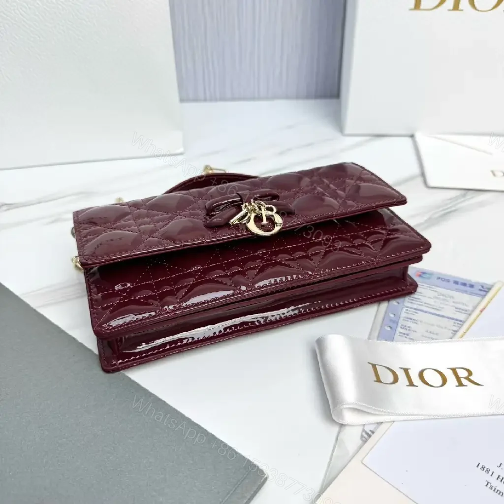 View 6 of Glossy Burgundy Quilted Mini Bag with Bow Accent