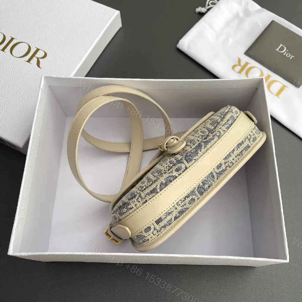 View 3 of Cream Leather-Trim Monogram Crossbody with Gold Turn-Lock, Compact Style