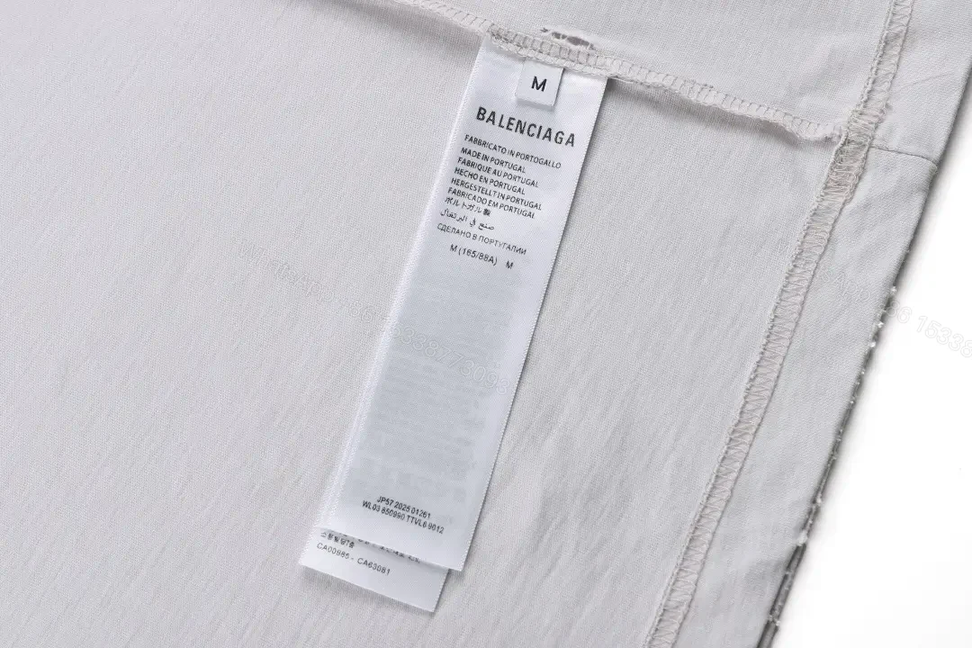 View 10 of Minimal White Cotton Tee: Subtle Logo, All-Day Comfort