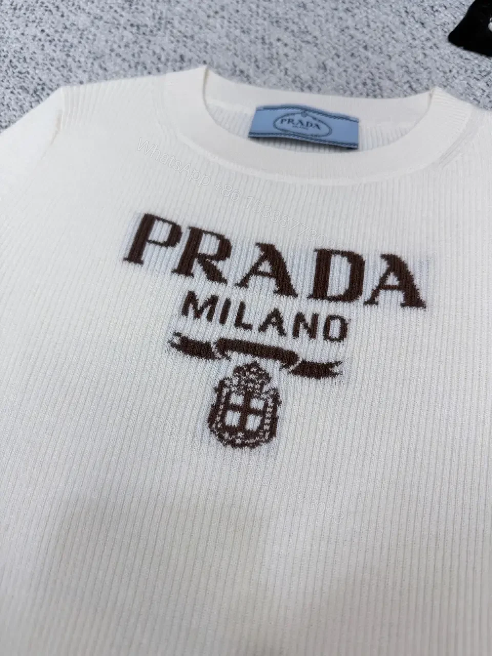 View 2 of Minimalist Ivory Knit Tee with Prominent Branding