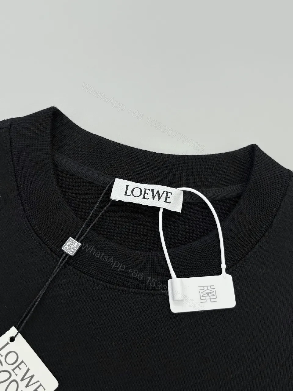 View 3 of Subtle Black Fleece Logo Sweatshirt, Luxe Casual