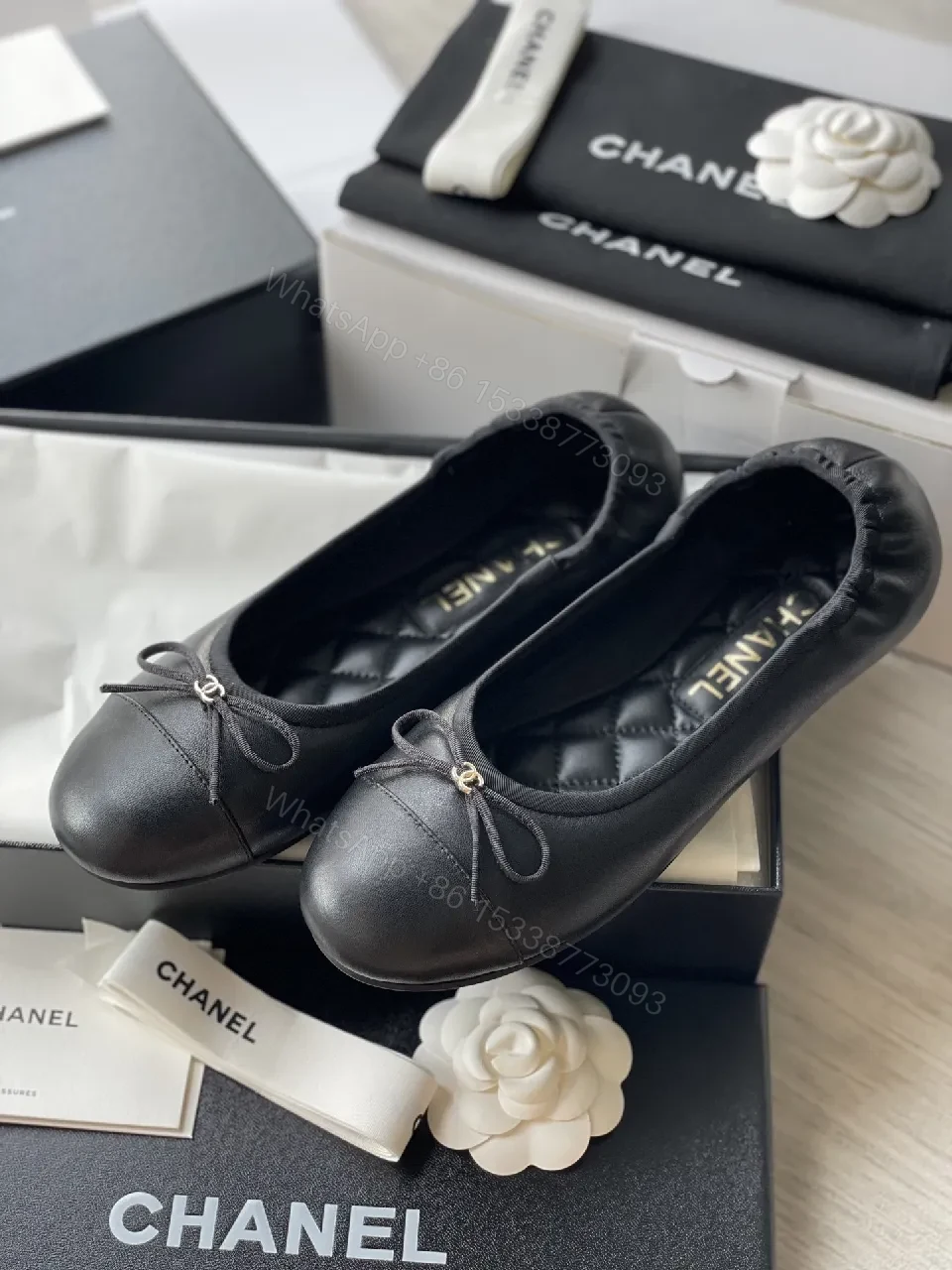 View 8 of Quilted Black Flats with Gold Logo Accents - Chic Comfort