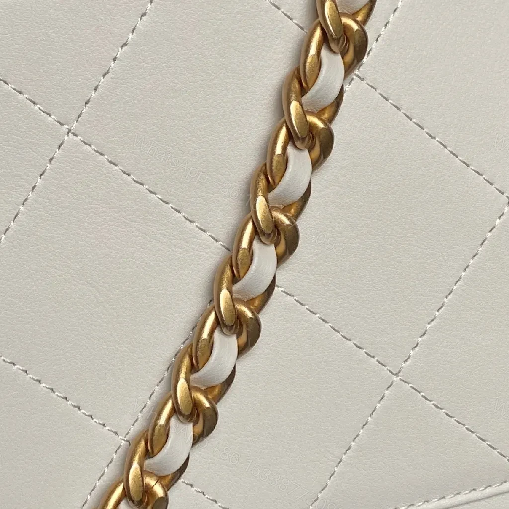 View 6 of White Quilted Mini Leather Bag with Gold Chain – Luxe Compact Style