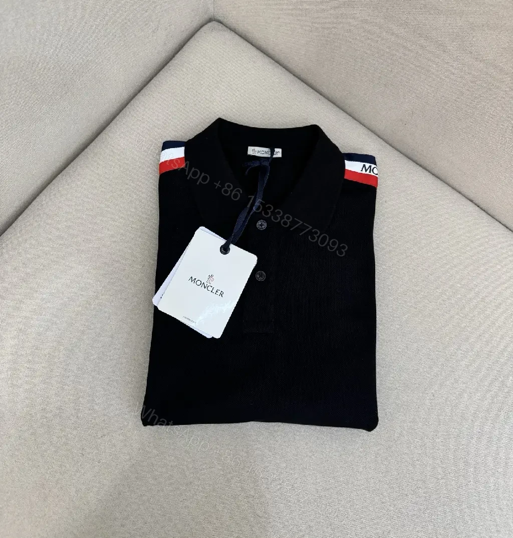 View 2 of Navy cotton polo shirt with red-white striped shoulder accents for everyday luxury
