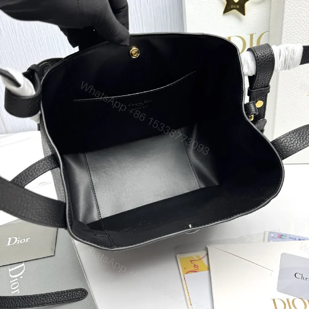 View 9 of Compact Black Pebbled Bucket Bag - Structured Luxury Everyday