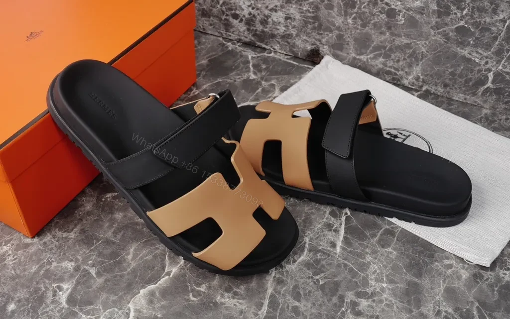View 3 of Hermes Oran Leather Slides â€” H-Cutout, All-Day Comfort, Black/Tan