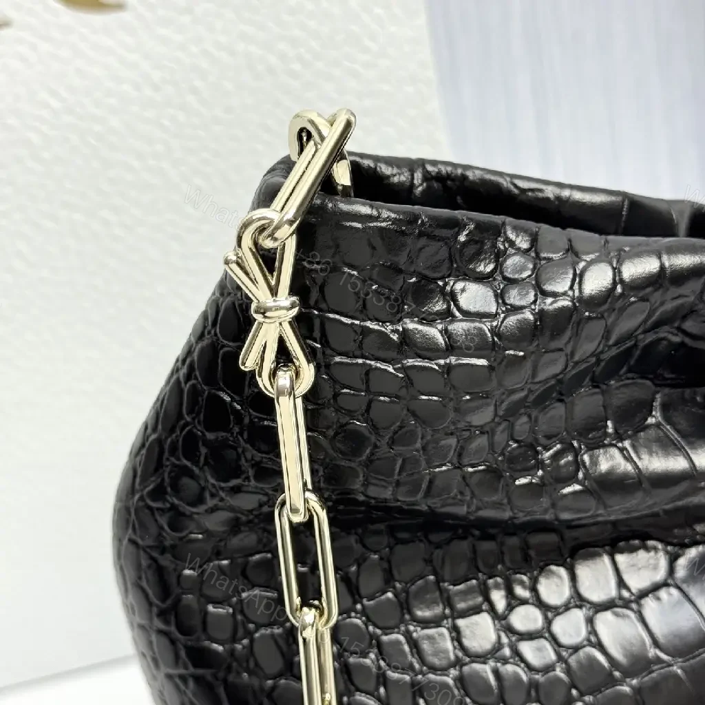 View 2 of Croc-Texture Bow Clutch: Leather Luxury, All-Day Glam