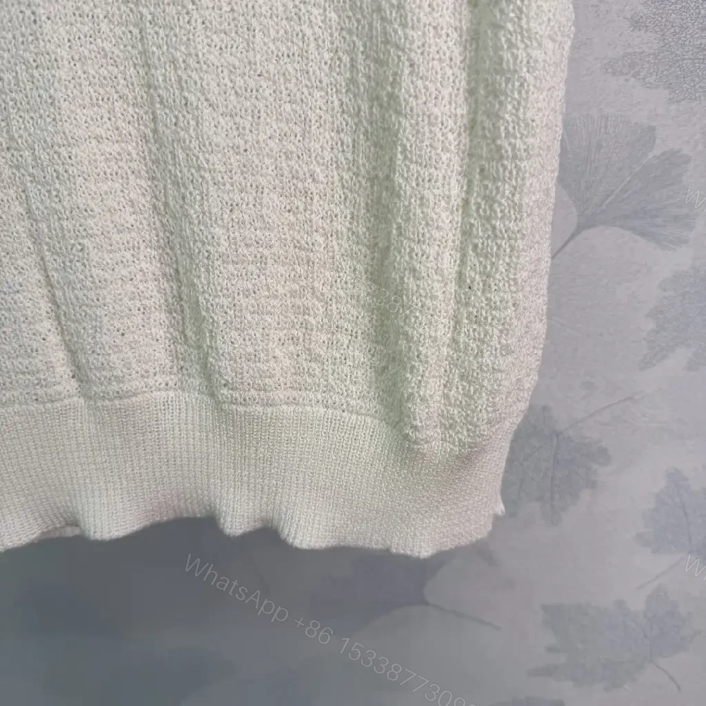 View 4 of White boucle knit relaxed-fit sweater with Chanel logo