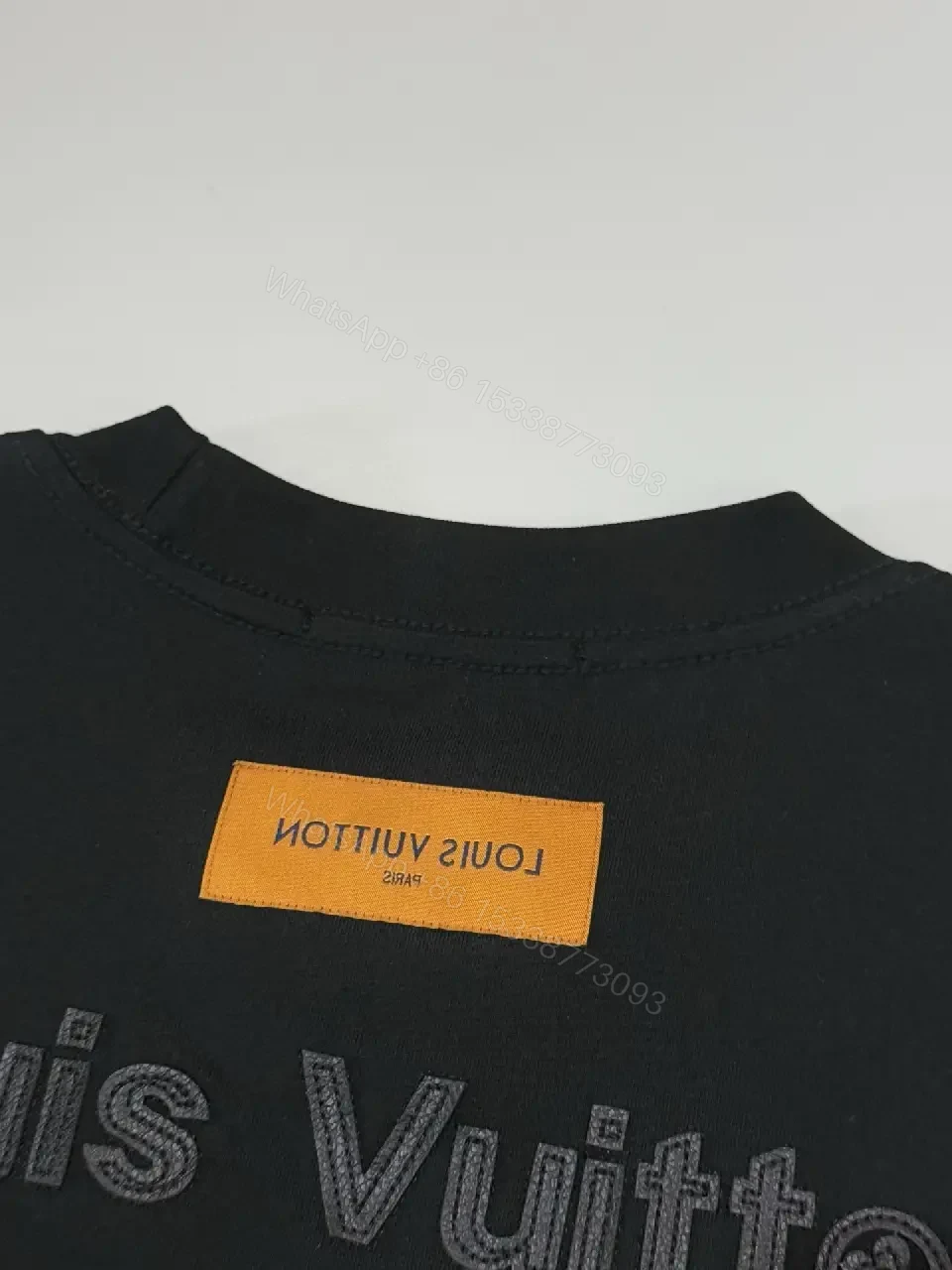 View 6 of Premium Black Tee — Discreet Logo, Soft Cotton Blend, Structured Fit
