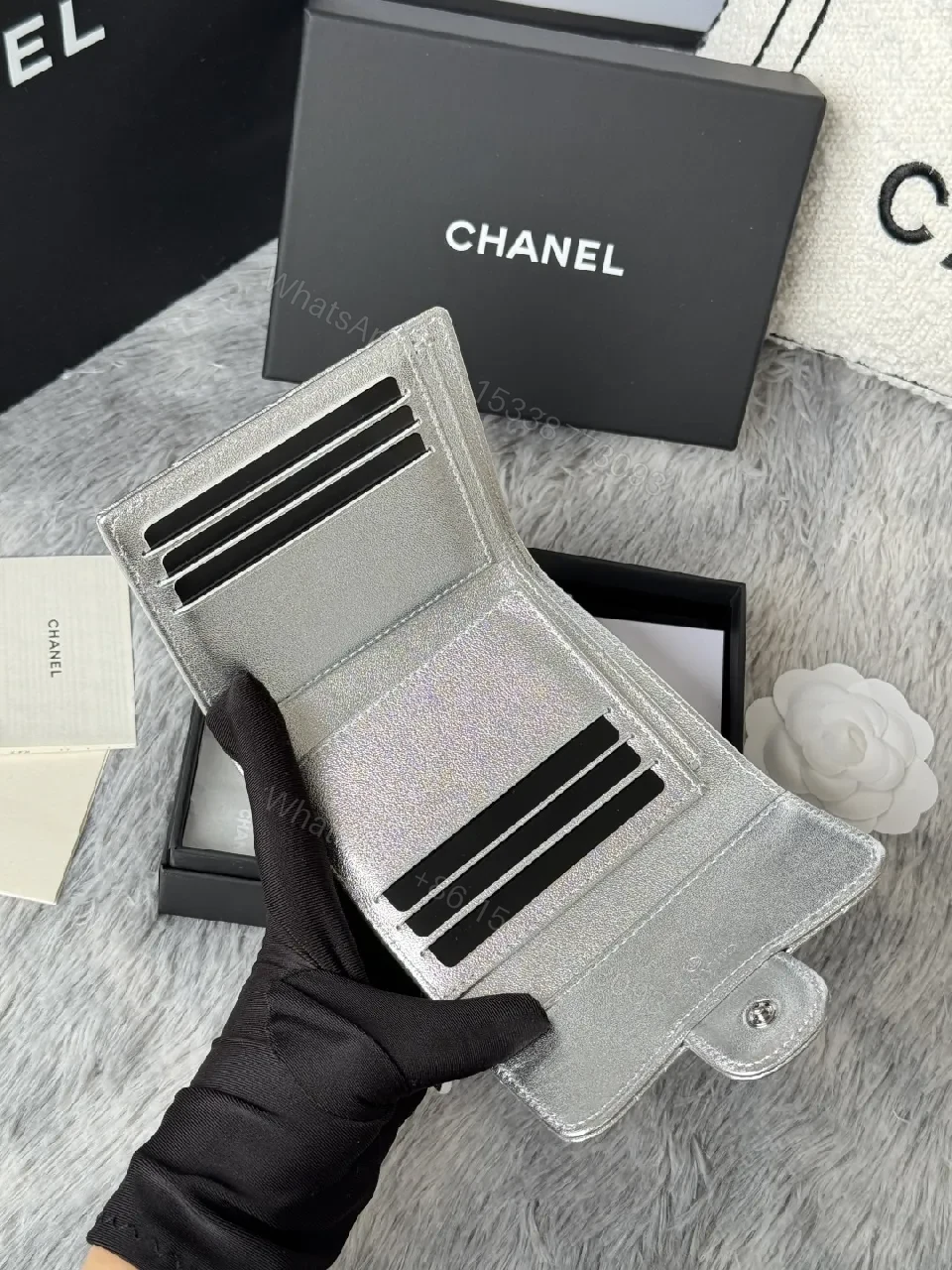 View 8 of Compact Silver Quilted Wallet with Signature Hardware