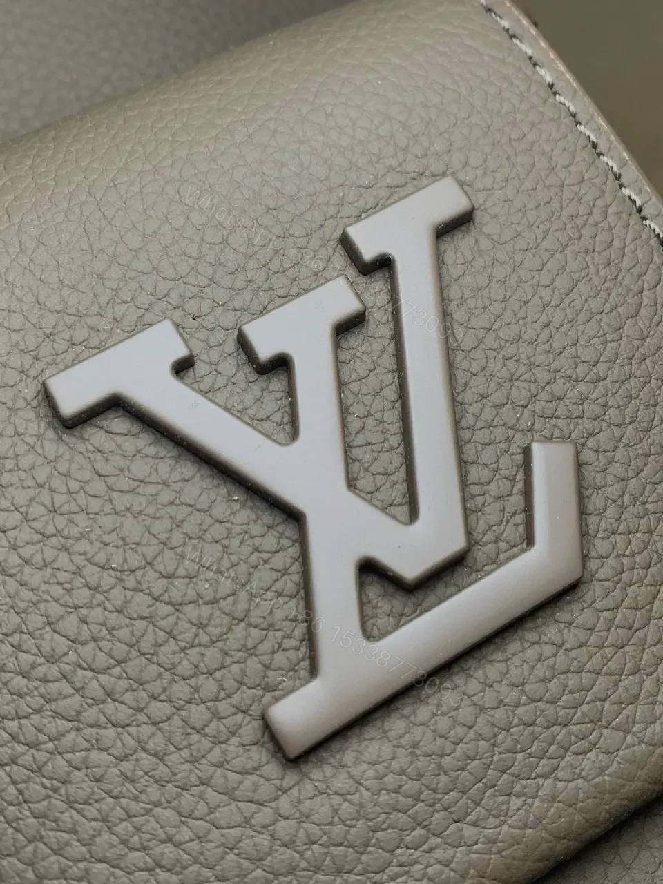View 7 of Structured Minimalist Leather Backpack with Subtle LV Motif