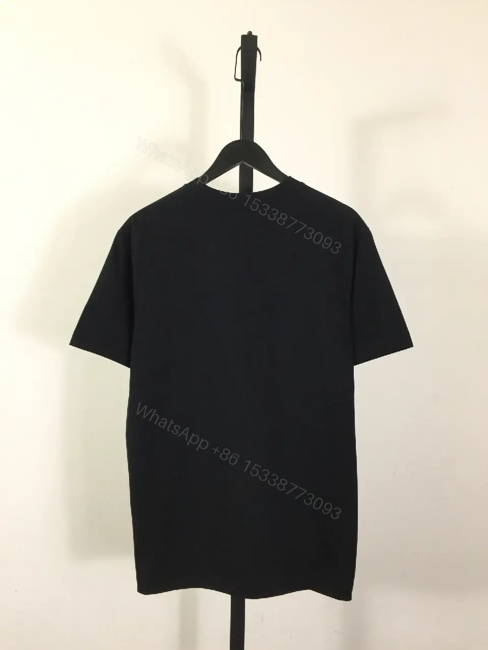 View 5 of Minimalist Black Cotton Tee with Graphic Burberry-Inspired Emblem
