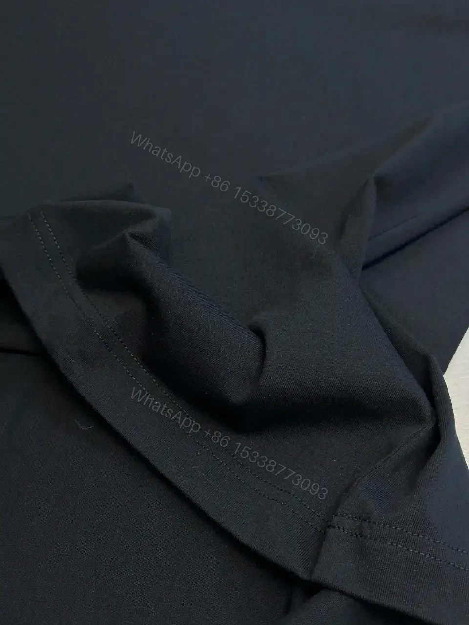 View 5 of Textured Logo Black Tee with Subtle Hardware - Premium Cotton Blend