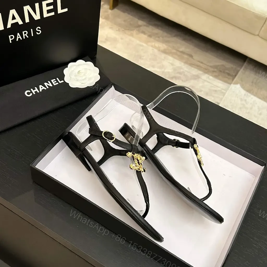 View 3 of Minimalist Black Leather Sandals with Gold Charms - Elegant Comfort