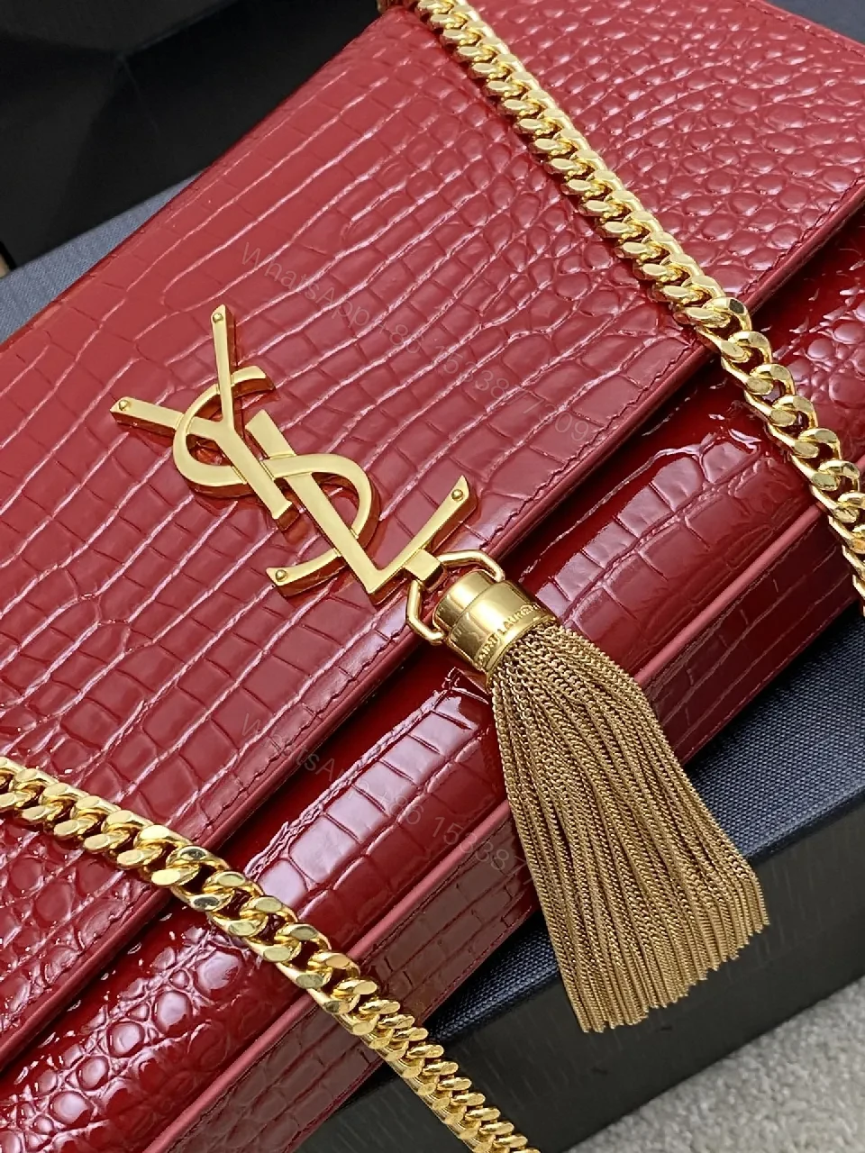 View 8 of Structured Red Leather Clutch with Gold Hardware and Tassel