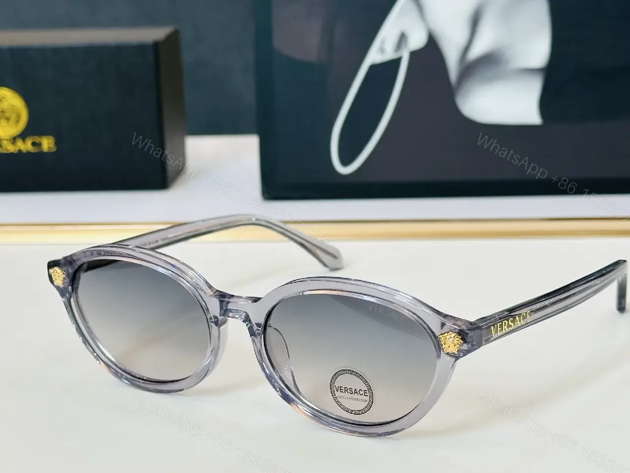View 5 of Glassy Black Round Sunglasses with Gold Accents, UV400 Protection