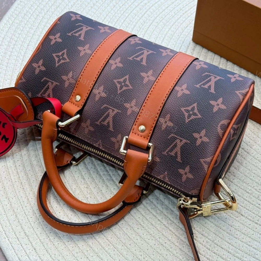 View 5 of Louis Vuitton Keepall Bandoulière 25 Monogram Dust Coated Canvas Brown 25Cm M11542