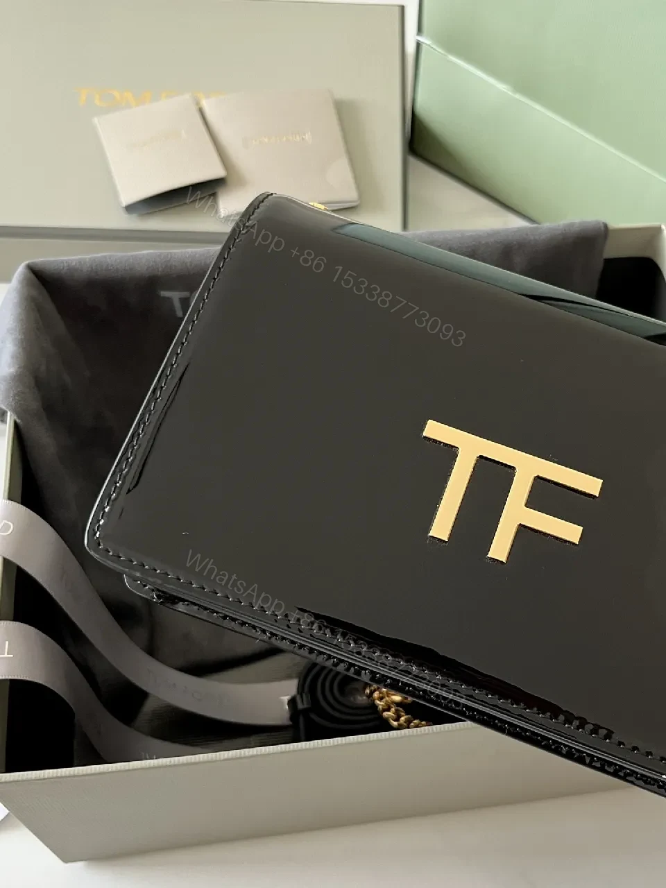 View 9 of Compact Black Leather Crossbody with Gold TF Emblem