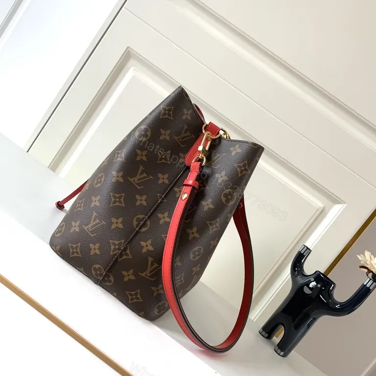 View 3 of Louis Vuitton-Style Monogram Bucket Bag: Red Leather Drawstring, Tote-like Versatility