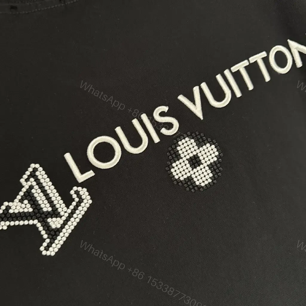View 4 of Oversized Black Knit Tee, Luxury Crest Embroidery, Casual Comfort