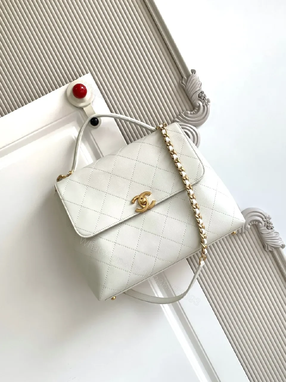 Quilted White Crossbody Bag with Gold Logo Accent — view 1
