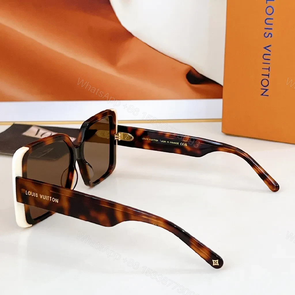 View 9 of Bold Black & White Frame Sunglasses with LV Detailing Luxe