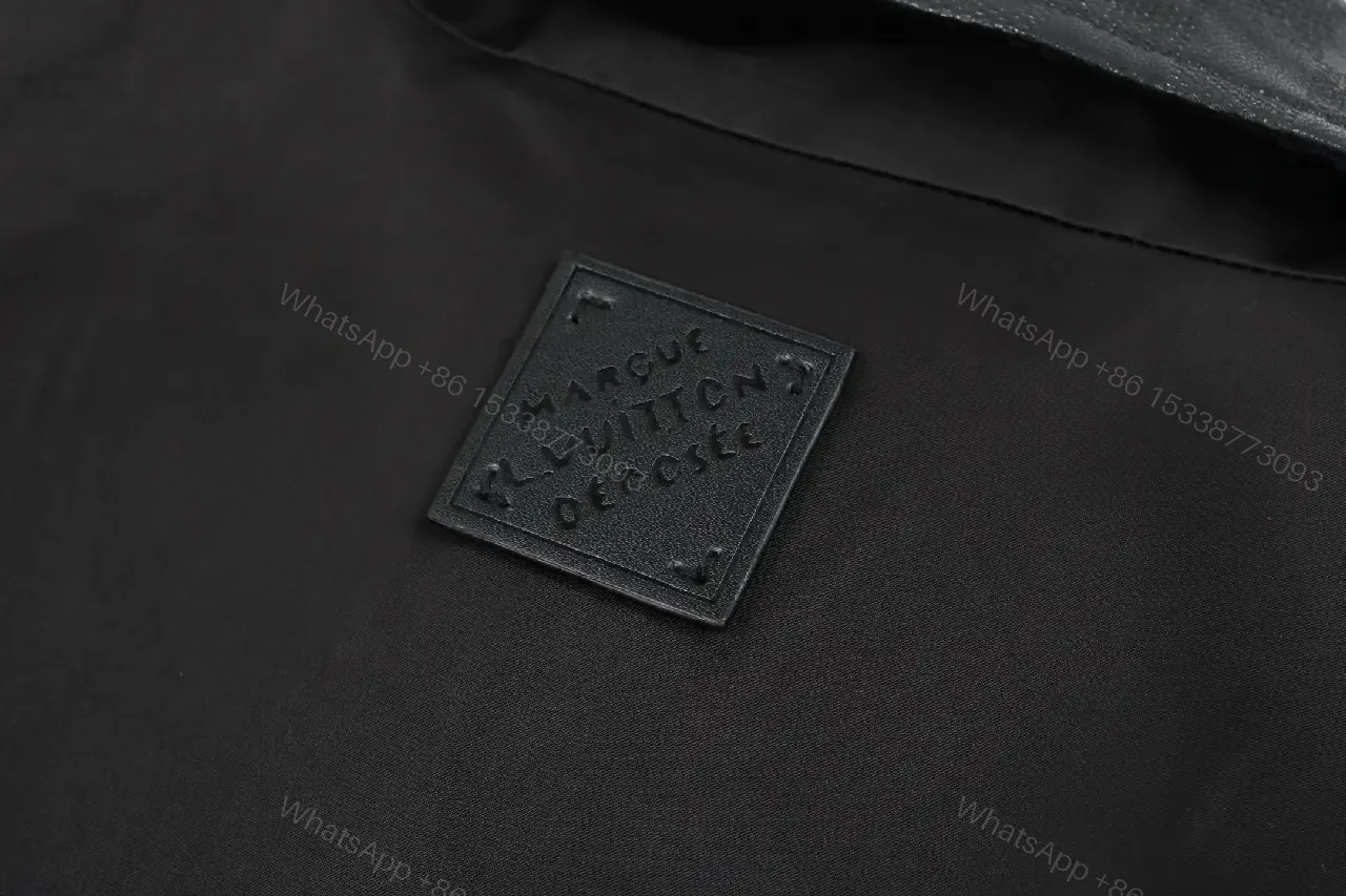 View 2 of Black Leather-Trim Coach Jacket with Subtle Logo Embroidery
