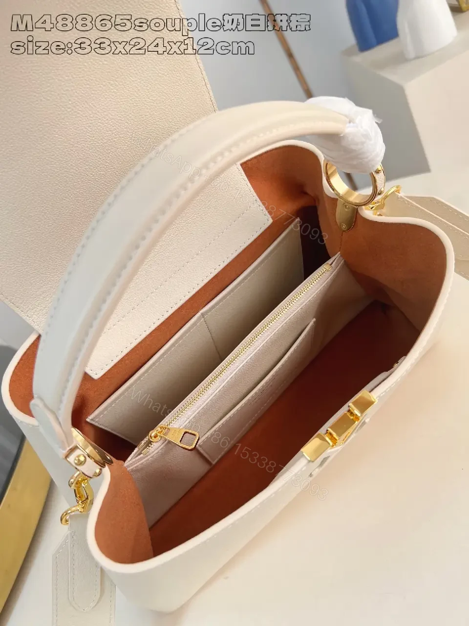 View 4 of Cream Pebbled Leather Structured Handbag with Gold Hardware