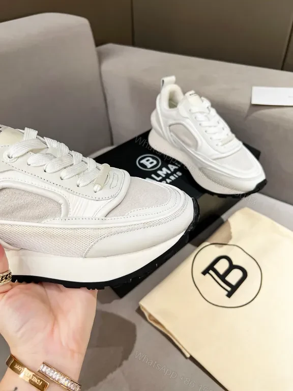 View 3 of Chic White Balmain High-Top Sneakers: Luxe Comfort