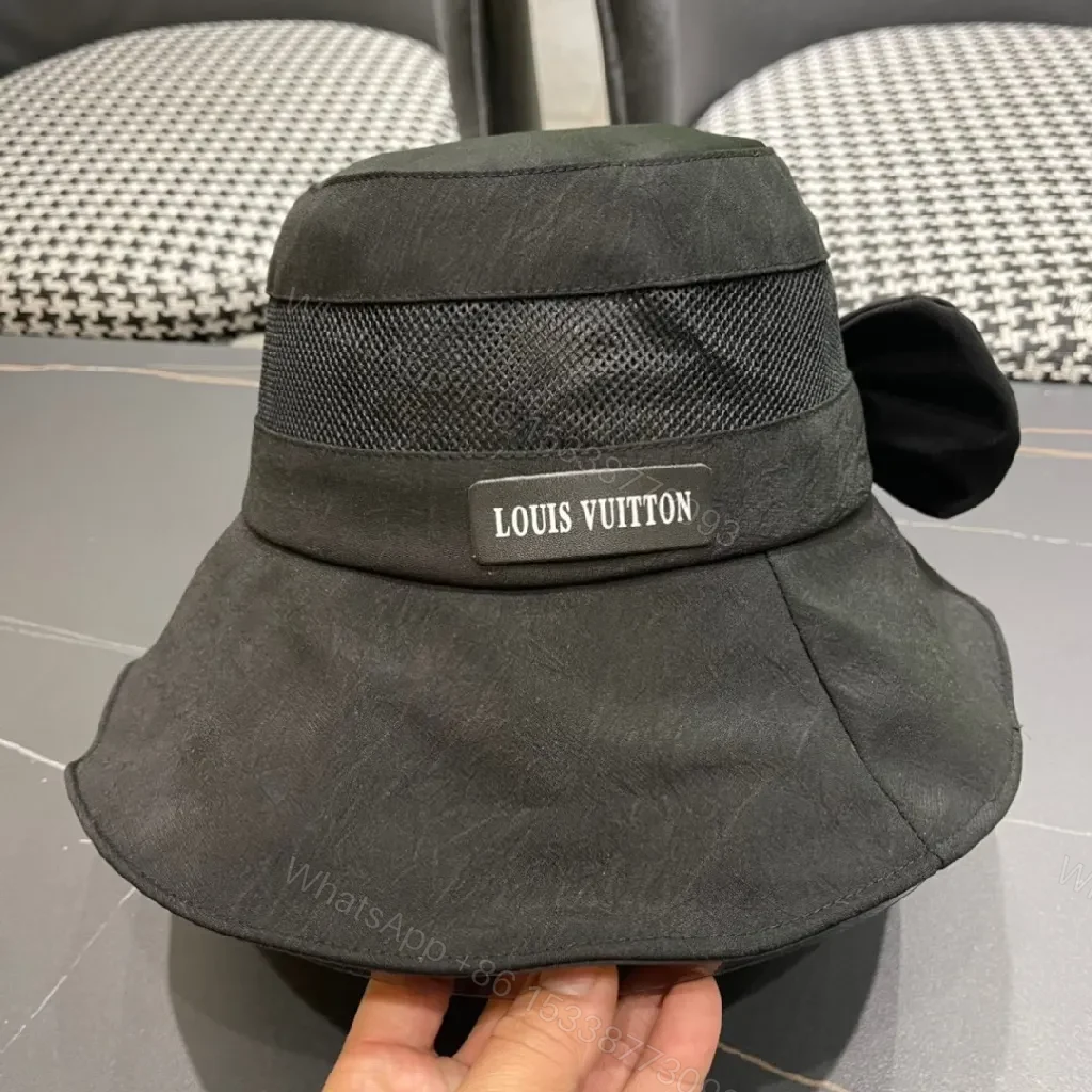 View 3 of Minimalist Black Bucket Hat with Discreet Luxe Label