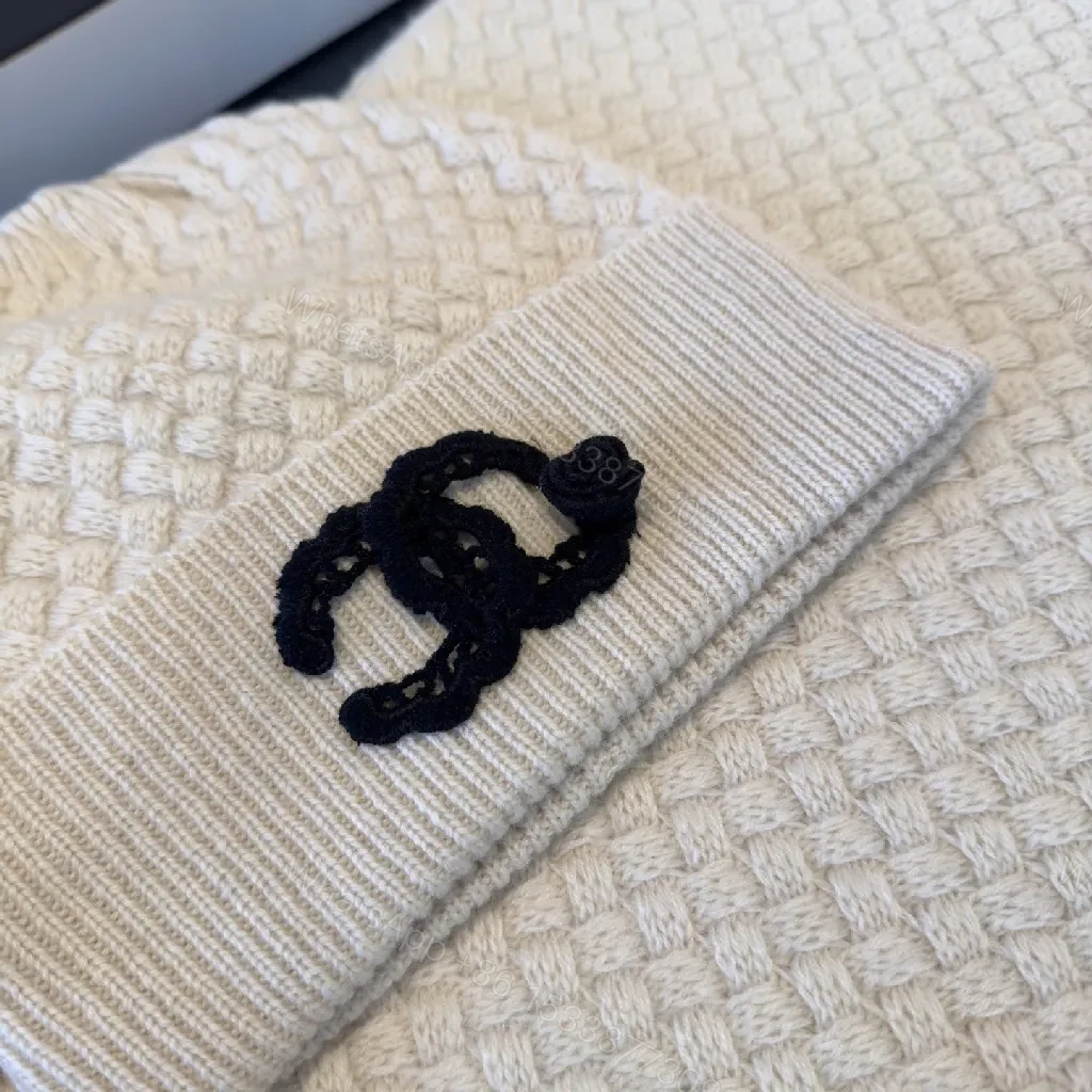 View 6 of Ivory Knit Set: Textured Luxury with Iconic Emblem