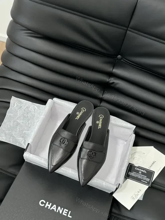 Chic Black Leather Mules with CC Detail - Luxury Comfort — view 1
