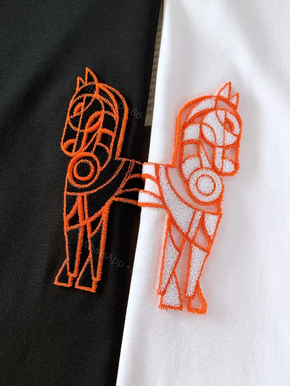 View 2 of Minimalist White Tee with Bold Orange Emblem T-Shirt