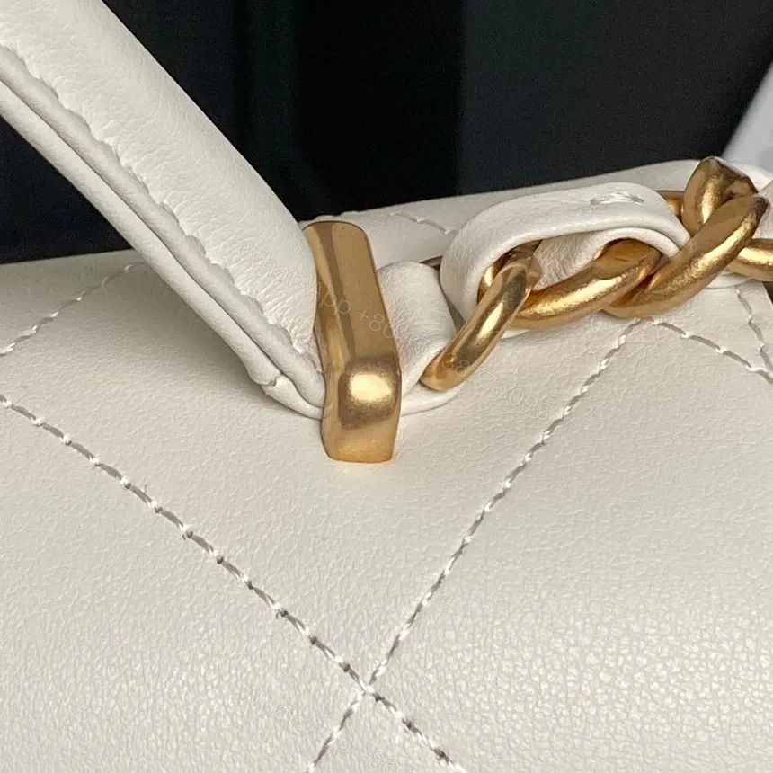 View 4 of White Quilted Mini Leather Bag with Gold Chain – Luxe Compact Style