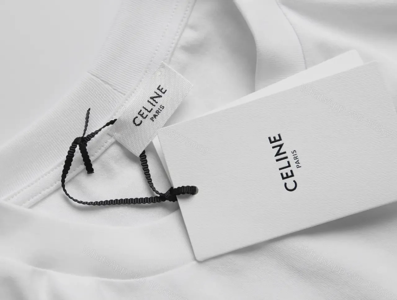 View 9 of White Cotton Graphic Tee: Bold CELINE-Inspired Minimalist Shirt