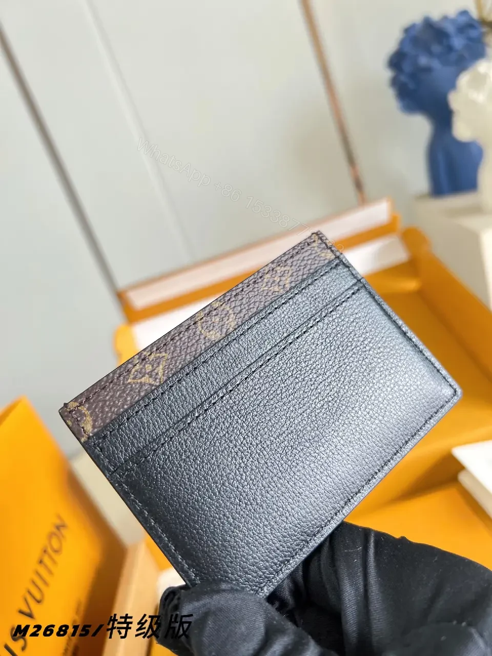 View 7 of Dark Navy Leather Bi-Fold Wallet with LV Monogram Texture