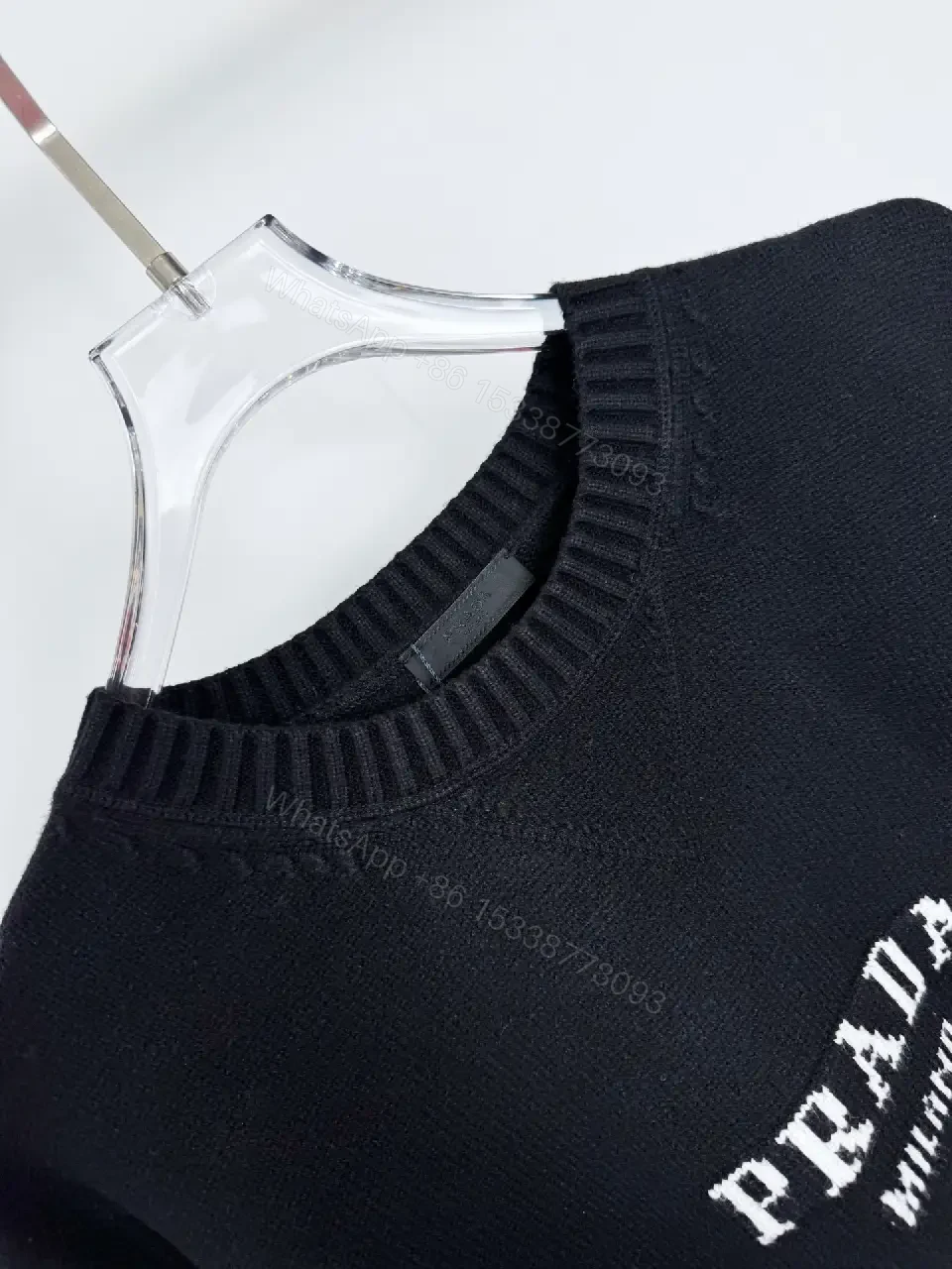View 10 of Black Knit Pullover with Crest – Elevated Comfort Knitwear