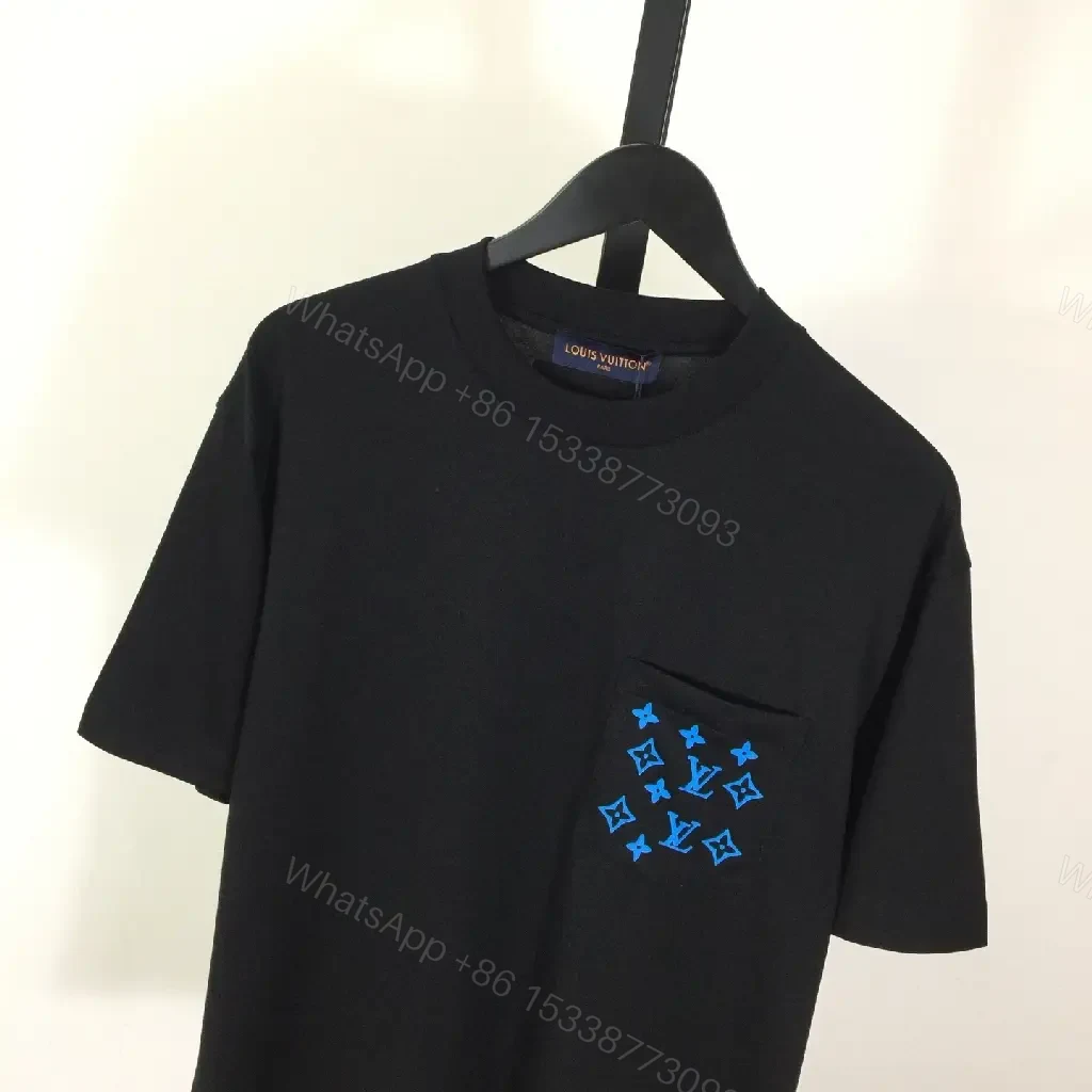 View 3 of Black Cotton Tee with Blue Pocket Embroidery — Luxe Streetwear Essential