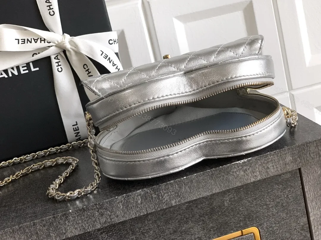 View 4 of Heart-Shaped Quilted Metallic Bag with Gold Hardware