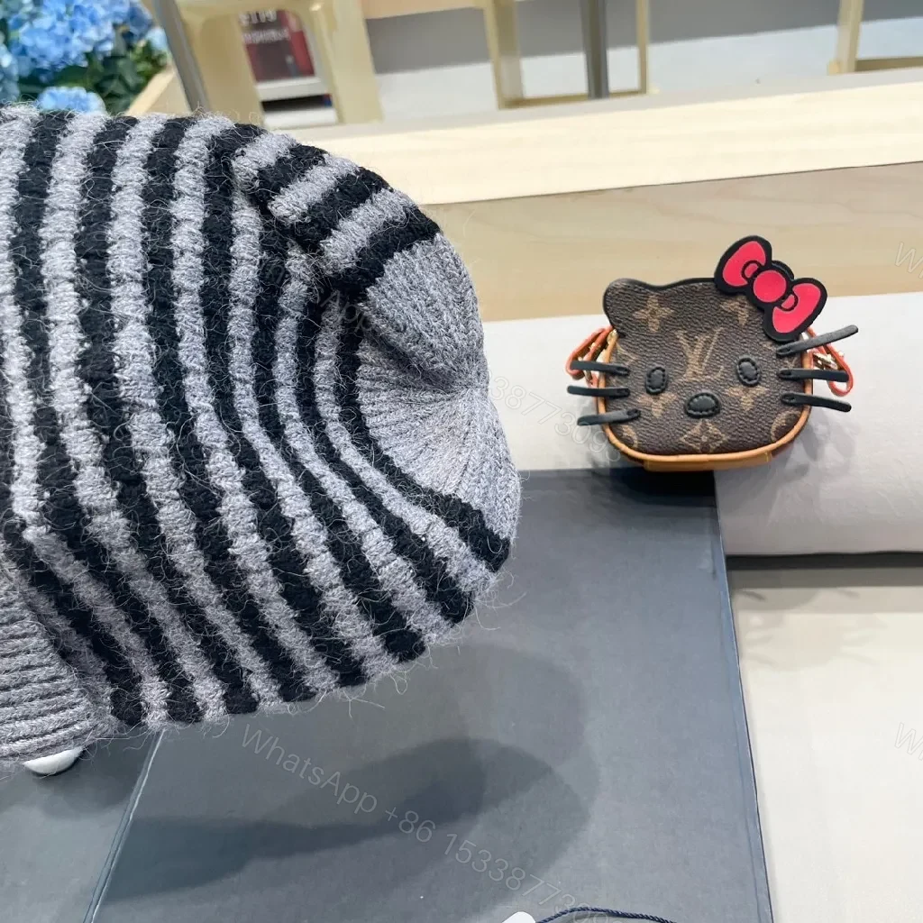 View 4 of Cozy Striped Knit Beanie with Moncler Badge - Luxe Warmth