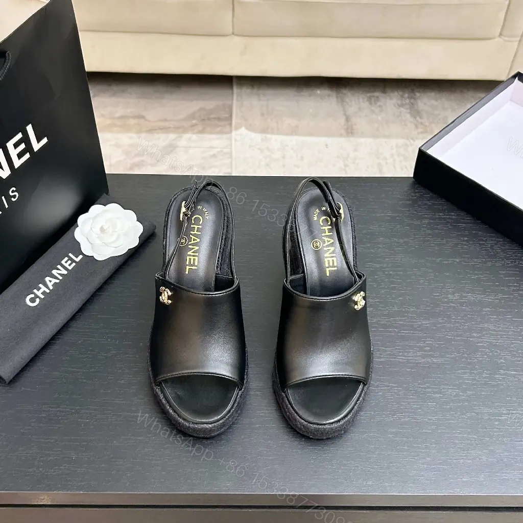 View 7 of Chic Black Leather Wedge Sandals - Gold Emblem, Open Toe, Slingback