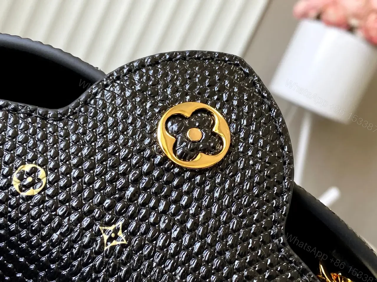View 8 of Compact Black Pebble-Grain Top-Handle Bag with Gold Hardware